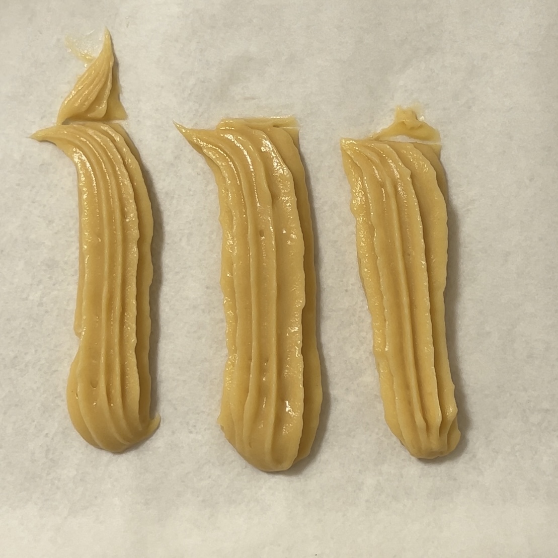 Churros piped onto cookie sheet (FAIL)