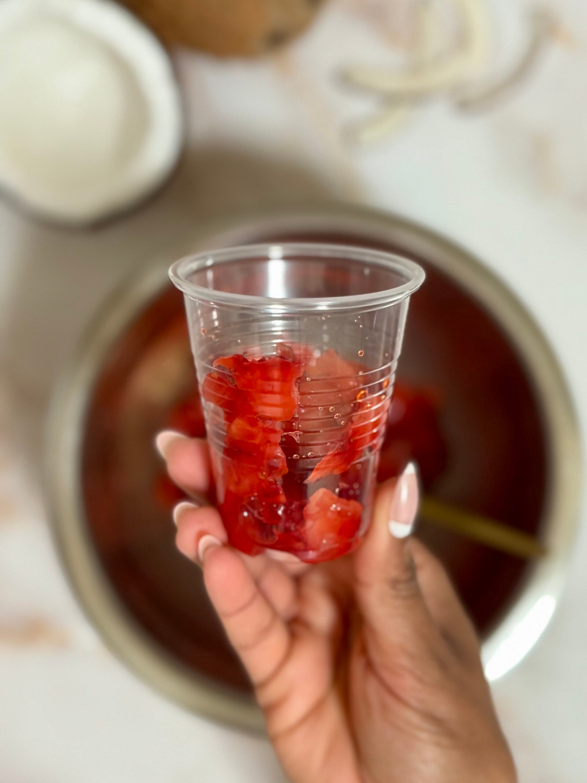 mashed strawberries in cup