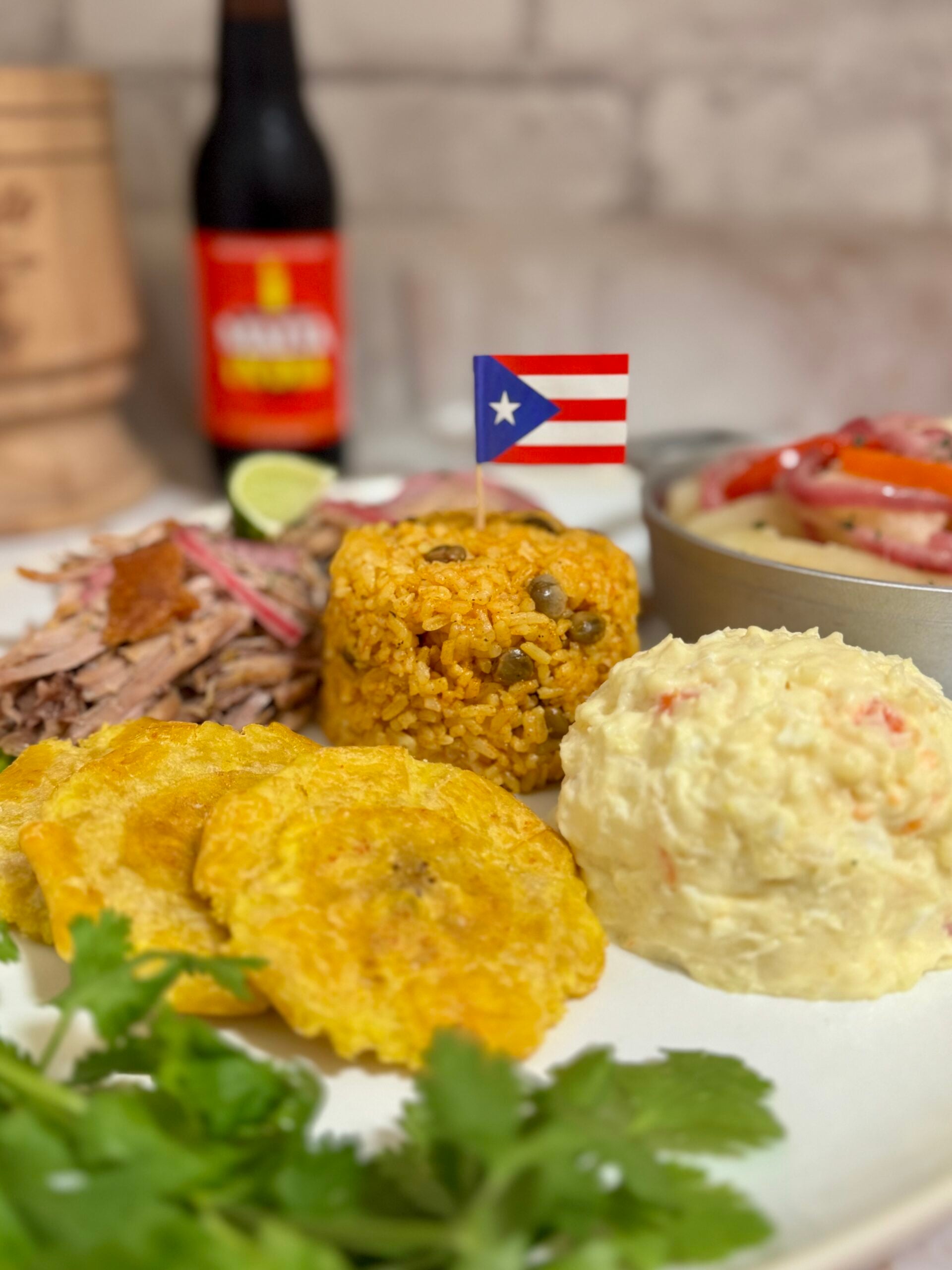 pernil, arroz con gandules, ensalada de papa, tostones