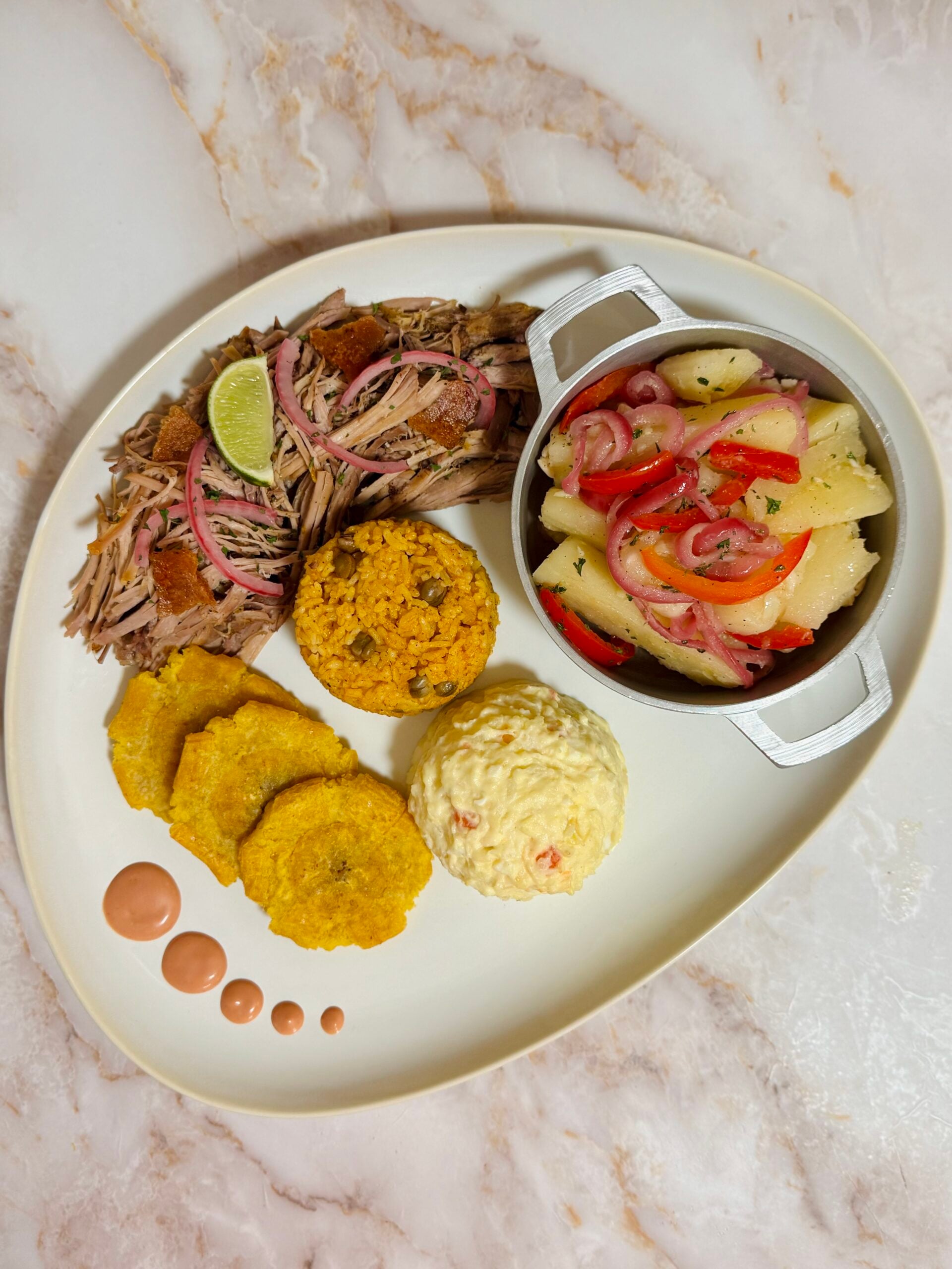 pernil, arroz con gandules, ensalada de papa, yuca con mojo, tostones